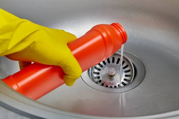 Pouring Drain Cleaner Into Sink.webp